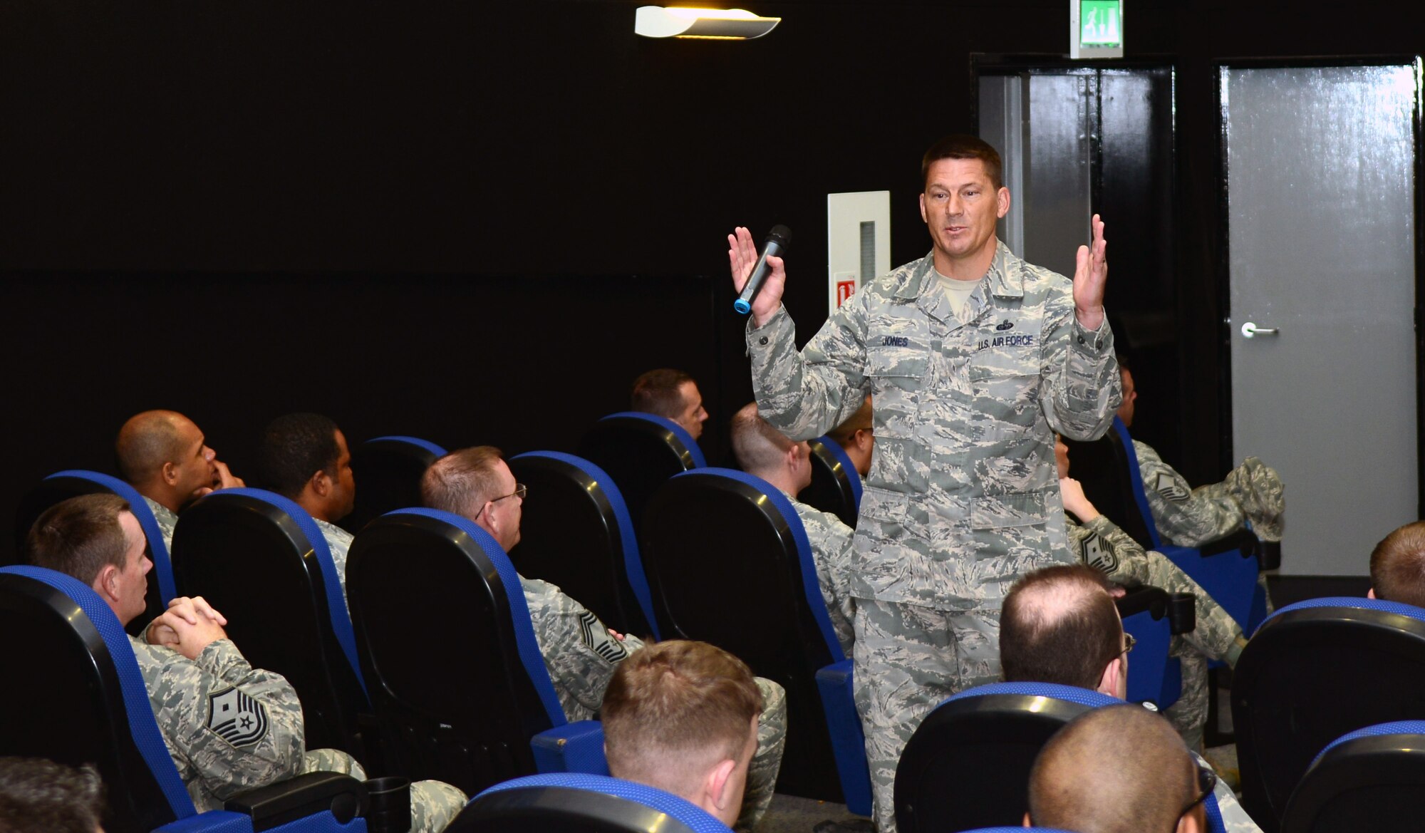 U.S. Air Force Chief Master Sgt. Tracy Jones, 100th Air Refueling Wing command chief, speaks to senior NCOs during an enlisted call Sept. 11, 2014, at the base theater on RAF Mildenhall, England. The enlisted call was held to engage with senior NCOs on base and to talk about what it means to serve in that role. (U.S. Air Force photo/Airman 1st Class Jonathan Light/Released)