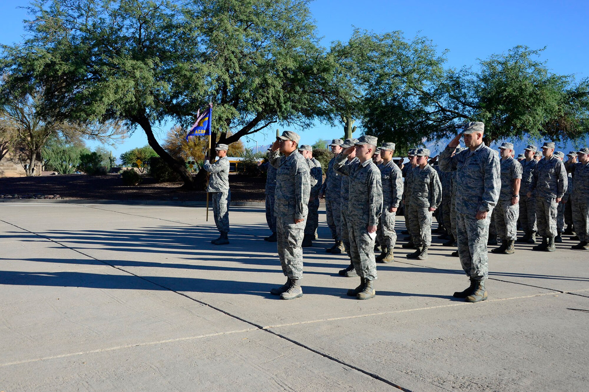 Members of the 612th Air Communications Squadron perform a final salute in remembrance of the victims of the Sept. 11, 2001 attacks at the end of their march around Davis-Monthan AFB, Ariz., Sept. 11, 2014. (USAF photo by Staff Sgt. Heather Redman/Released)