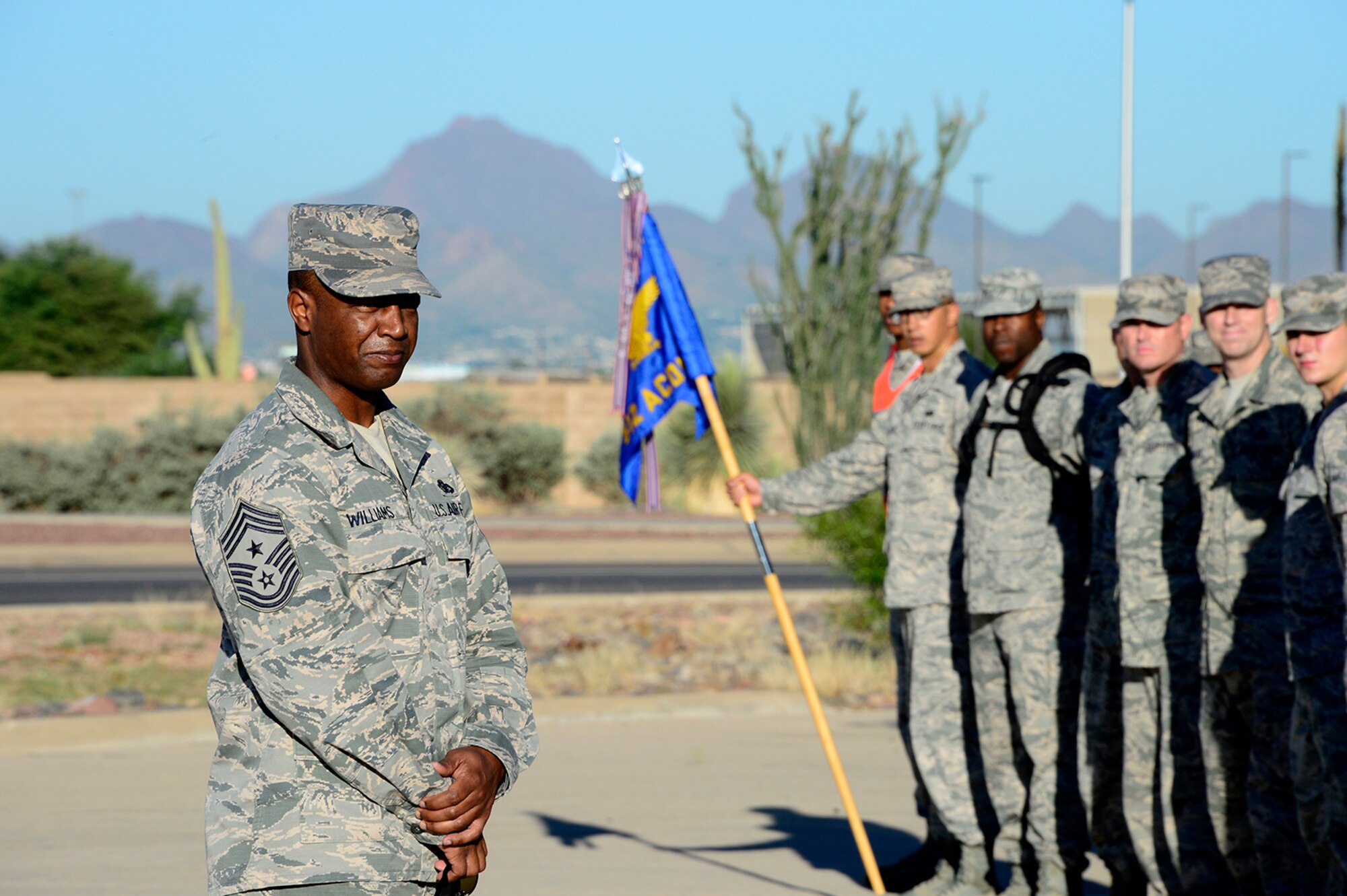 Chief Master Sgt. Calvin Williams, 12th Air Forces Southern (Command Chief), speaks with members of the 612th Air Communications Squadron at the end of their march around Davis-Monthan AFB, Ariz., in remembrance of the 9/11 victims, Sept. 11, 2014. (USAF photo by Staff Sgt. Heather Redman/Released)