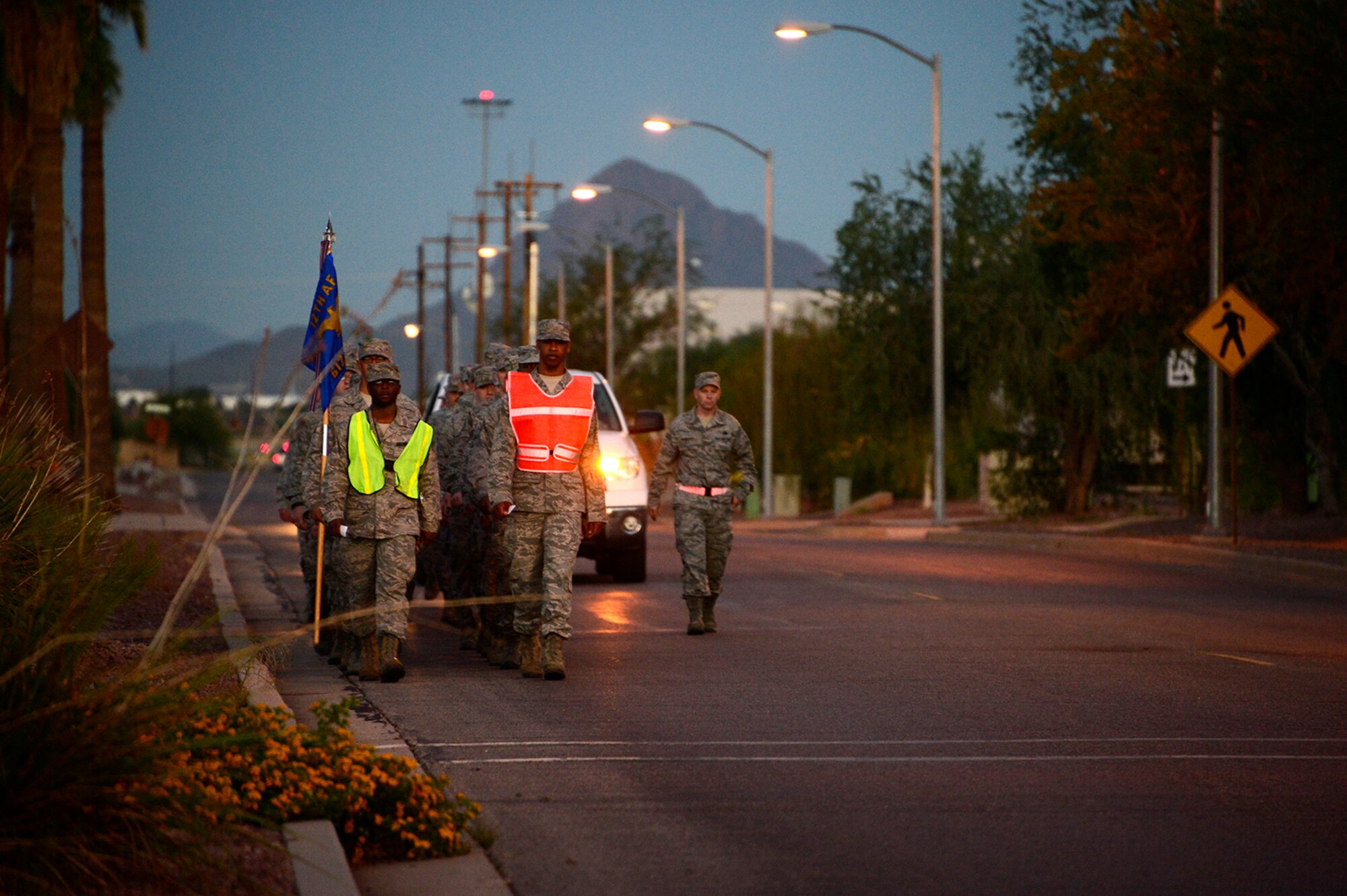 Members of the 612th Air Communication Squadron march around Davis-Monthan AFB, Ariz., in remembrance of the 9/11 victims, Sept. 11, 2014. As members marched they recalled where they were during the attacks. (USAF photo by Staff Sgt. Heather Redman/Released)
