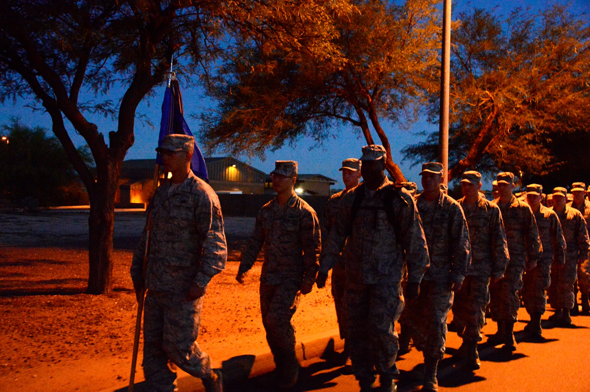 Members of the 612th Air Communication Squadron march around Davis-Monthan AFB, Ariz., in remembrance of the 9/11 victims, Sept. 11, 2014. As members marched they recalled where they were during the attacks. (USAF photo by Staff Sgt. Heather Redman/Released)
