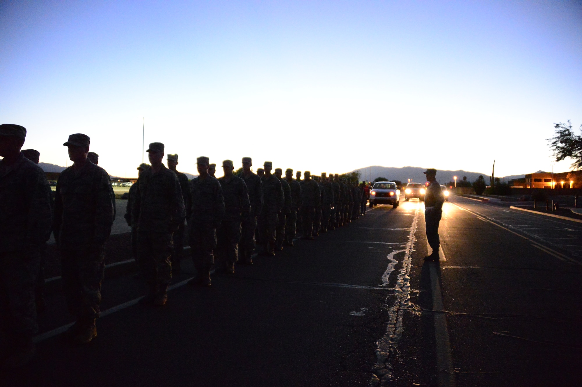 Members of the 612th Air Communication Squadron march around Davis-Monthan AFB, Ariz., in remembrance of the 9/11 victims, Sept. 11, 2014. As members marched they recalled where they were during the attacks. (USAF photo by Staff Sgt. Heather Redman/Released)