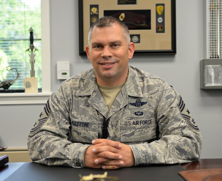 Chief Master Sgt. Tommy Mazzone, 2nd Bomb Wing Command Chief, sits at his desk on Barksdale Air Force Base, La. Sept. 10, 2014. Mazzone joined the Air Force in 1990 and began his career in security forces. He later retrained to become a C-130E Hercules loadmaster. (U.S. Air Force photo/Airman 1st Class Benjamin Raughton)