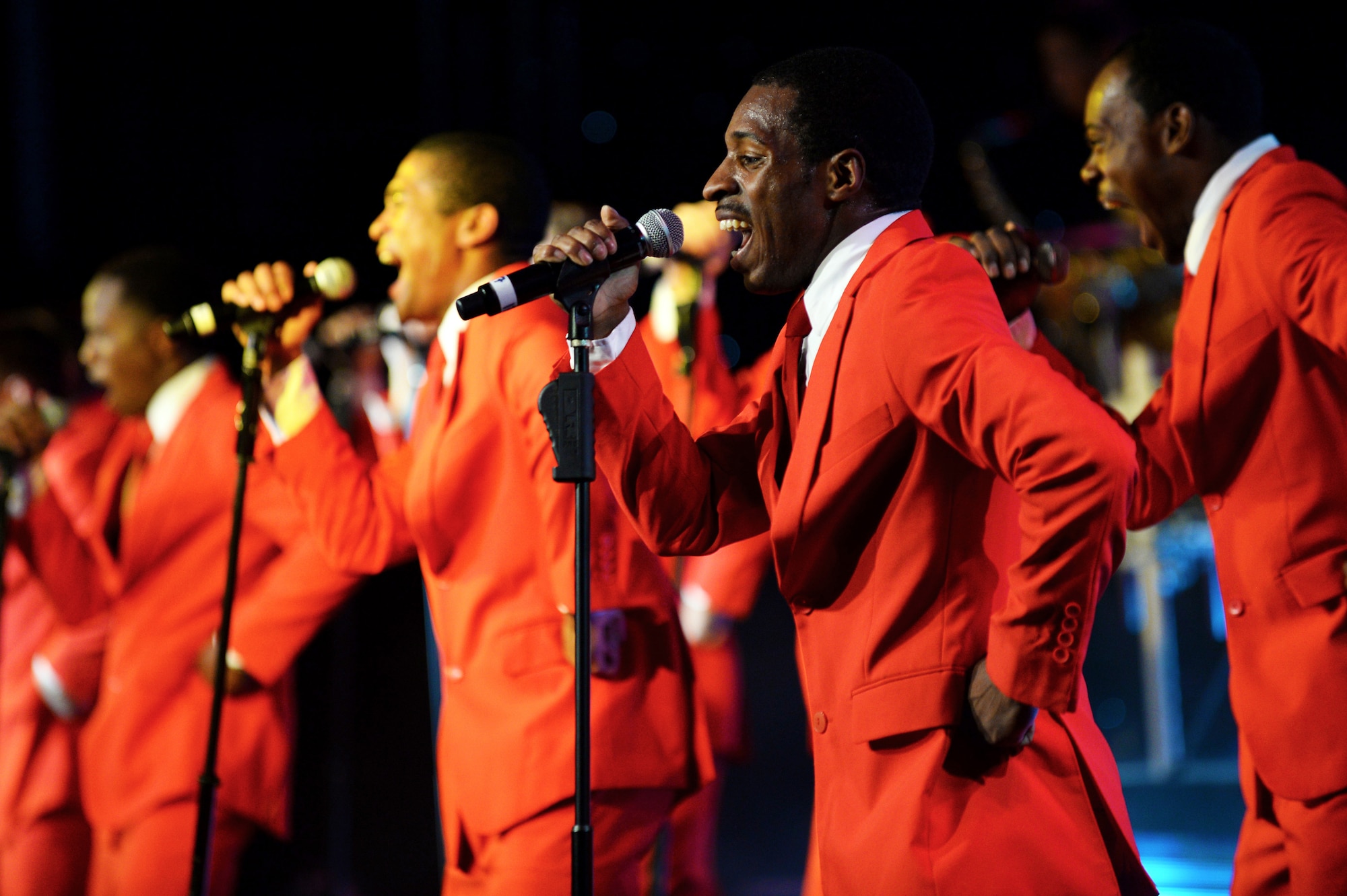 Tops in Blue singers perform on stage during their 60th Anniversary Tour at the Skelton Memorial Fitness Center at Spangdahlem Air Base, Germany, Sept. 9, 2014. The group has performed for heads of state and dignitaries throughout the world and has also toured throughout Europe, the Middle East, Central America, Asia and all 50 states of America. (U.S. Air Force photo by Airman 1st Class Timothy Kim/Released)