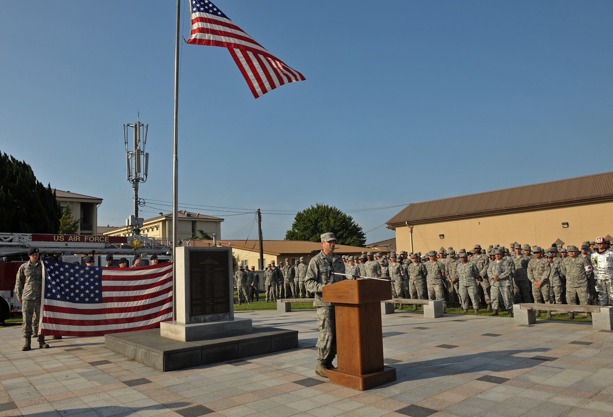 Col. Jeffery “Wolf II” Valenzia, 8th Fighter Wing vice commander, addresses the Wolf Pack during a Sept. 11 remembrance ceremony at Kunsan Air Base, Republic of Korea. Wolf II provided the opening remarks, followed by two Airmen who volunteered their personal accounts of 9/11 and how it impacted their lives and their decision to enlist in the U.S. Air Force. (U.S. Air Force photo by Senior Airman Katrina Heikkinen/Released)