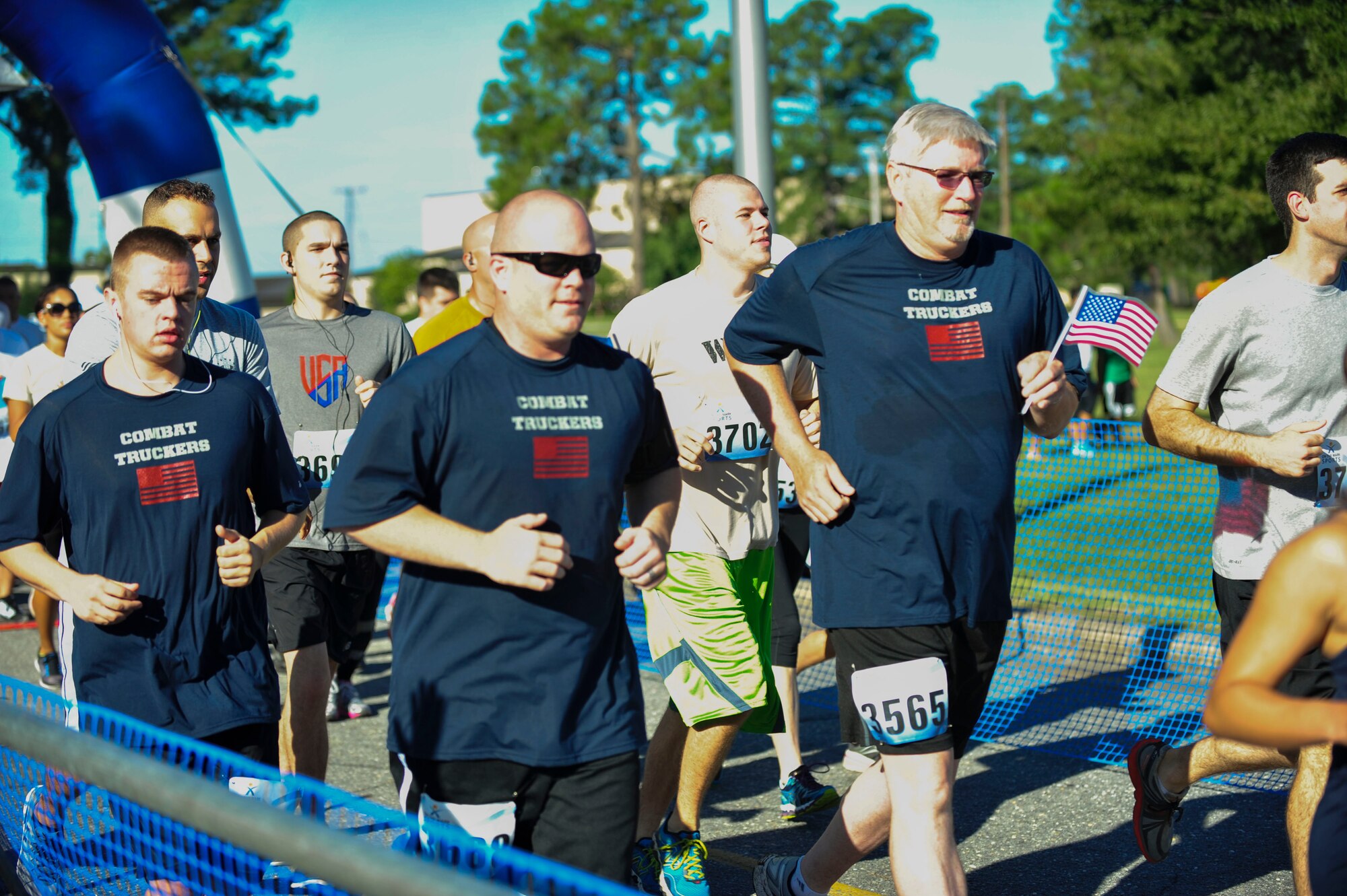 A group of runners, supporting fallen comrades in the field of vehicle operations and convoy movements, participate in the second annual Run for the Fallen 5K/Half-Marathon on Sept. 6 at Seymour Johnson Air Force Base, North Carolina. Military units participated in the run in support of fallen comrades within their specific career fields. One such group was the 4th Logistics Readiness Squadron, who honored those who’ve paid the ultimate sacrifice by wearing t-shirts with names of the fallen on the back. [Note: The Seymour Johnson Air Force Base Company Grade Officer's Council is a private organization. It’s not a part of the Department of Defense or any of its components and it has no governmental status] (U.S. Air Force photo/Airman 1st Class Shawna L. Keyes)
