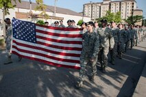 First responders from Kunsan Air Base, Republic of Korea, lead Wolf Pack Airmen during a silent walk honoring the 13th anniversary of Sept. 11, 2001. Kunsan 5/6 hosted the silent walk, which paid homage to the 2,977 innocent victims who were lost. (U.S. Air Force photo by Senior Airman Katrina Heikkinen/Released)
