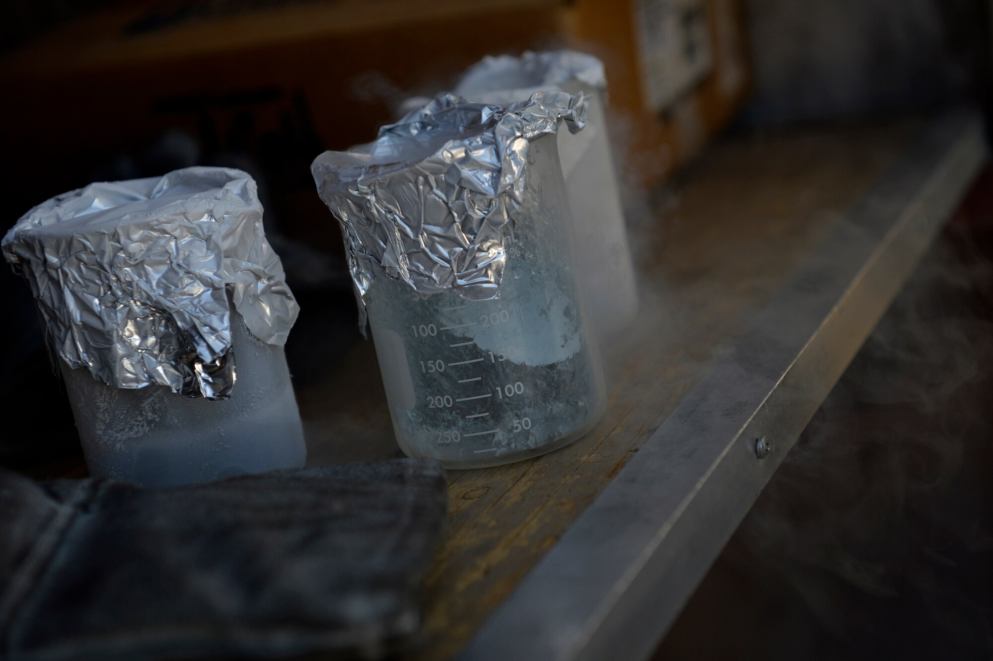 Liquid oxygen samples sit on a shelf at Bagram Airfield, Afghanistan Aug. 5, 2014.  Cryogenic technicians test liquid oxygen to ensure its purity.  Cryogenics Airmen support 6,000 aircraft missions and provide more than 4,000 gallons of liquid oxygen per month. (U.S. Air Force photo by Staff Sgt. Evelyn Chavez/Released)