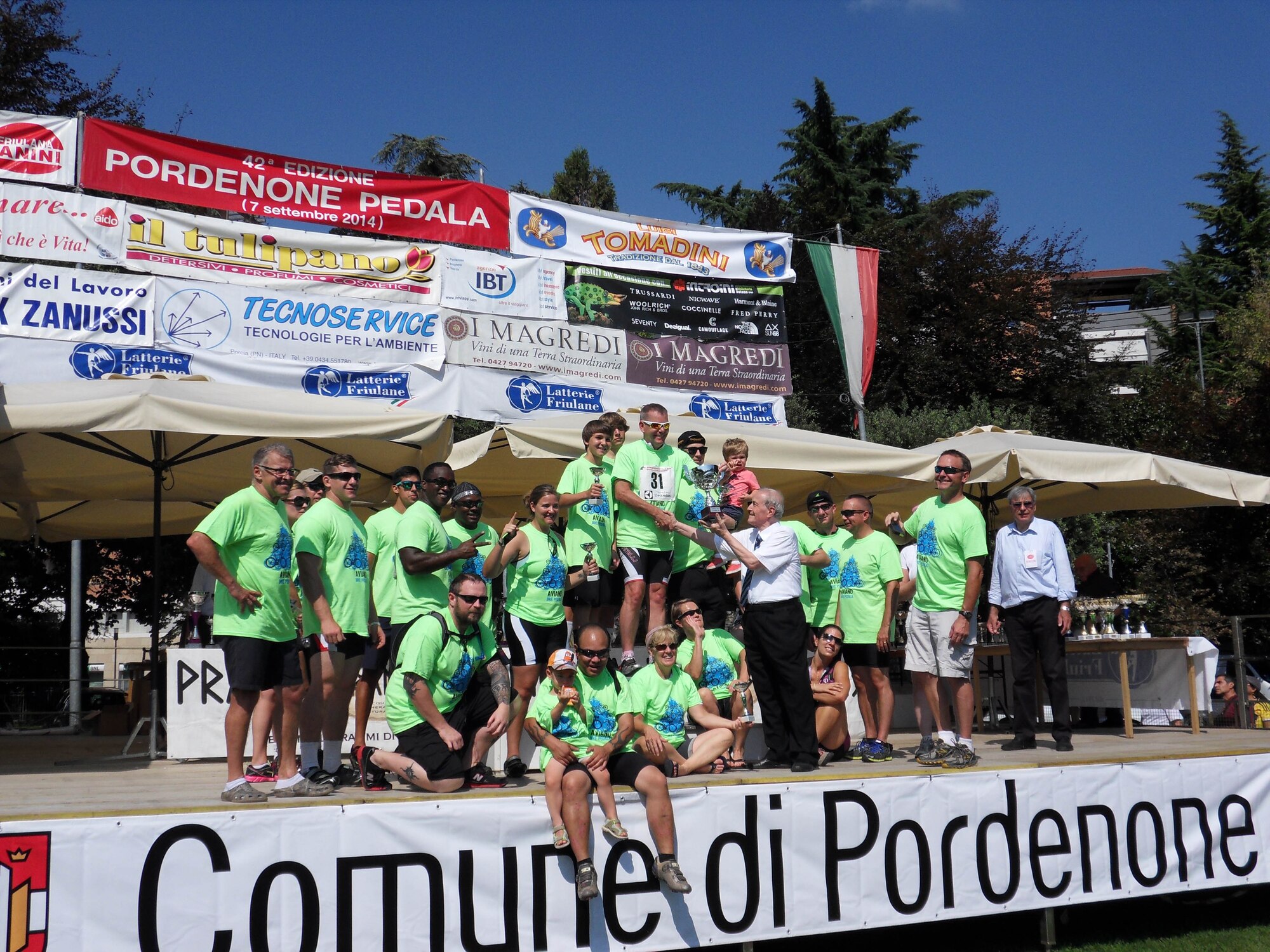 Team Aviano members are presented a trophy after the 42nd Annual Pordenone Pedala bike ride, Sept. 7, 2014, in Pordenone, Italy. The event that started in Pordenone had riders cycle approximately 28 miles through 12 local Italian towns. (Courtesy Photo)