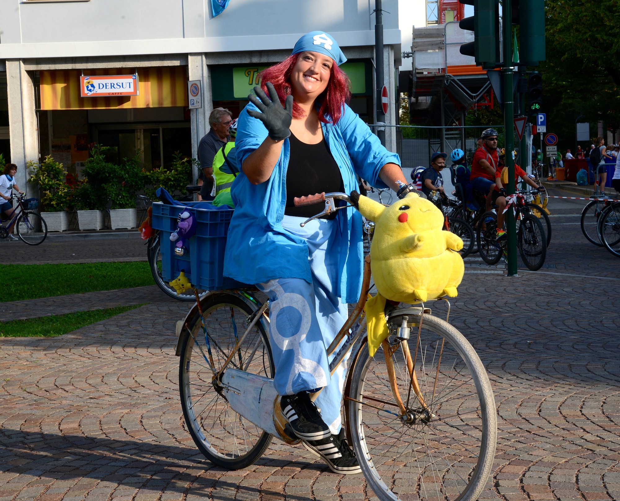 A participant wearing a Pokémon costume greets riders at the starting line of the 42nd Annual Pordenone Pedala bike ride, Sept. 7, 2014, in Pordenone, Italy. The event that started in Pordenone had riders cycle approximately 28 miles through 12 local Italian towns. (U.S. Air Force photo/Capt. Lacie Collins)