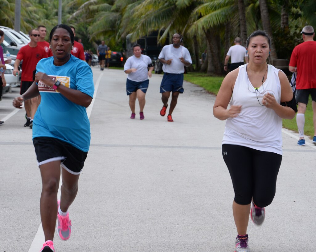 Participants in the Remembering our Heroes 5K run toward the finish line at Tarague Beach Sep. 11, 2014, on Andersen Air Force Base, Guam. The run, which drew approximately 200 participants, was hosted by the Coral Reef Fitness Center and served as a tribute to the 9/11 tragedy that occurred Sept 11, 2001 in New York City and Washington D.C. when two airplanes were flown into the World Trade Center and Pentagon resulting in over 3,000 deaths including more than 400 police officers and firefighters. (U.S. Air Force photo by Senior Airman Cierra Presentado/Released)