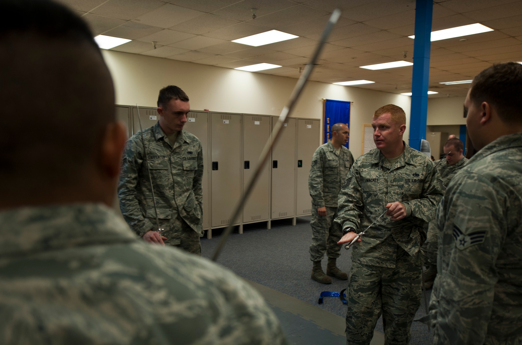 Tech. Sgt. Patrick Mackey, NCO in charge of the Honor Guard, instructs potential Guardsmen on sabers during the 366th Fighter Wing Honor Guard all-call, Sept. 9, 2014, at Mountain Home Air Force Base, Idaho. “We represent every member, past and present, of the United States Air Force,” said Mackey. “Our standards of conduct and level of professionalism are above reproach. We are the epitome of integrity first, service before self, and excellence in all we do. We are Ceremonial Guardsmen.” (U.S. Air Force photo by Staff. Sgt. Roy Lynch III/RELEASED)