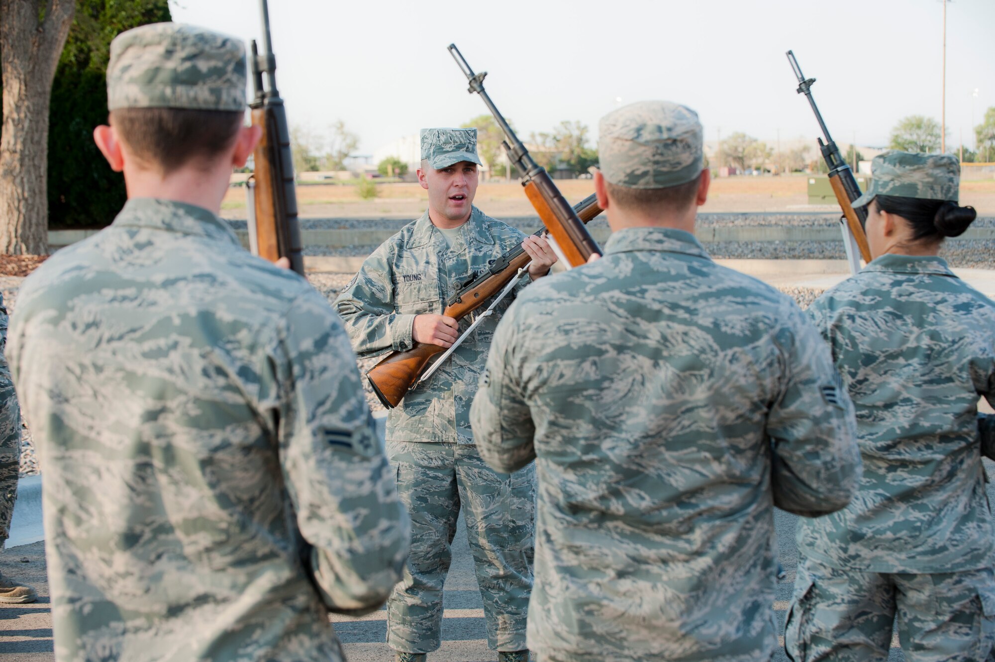 Senior Airman Alexander Young, 726th Air Control Squadron material control journeyman, teaches Airmen how to use their rifles during the 366th Fighter Wing Honor Guard all-call, Sept. 9, 2014, at Mountain Home Air Force Base, Idaho. The all-call is a way to bring the whole Honor Guard together and inform potential Guardsmen about the benefits and opportunities of being a part of the MHAFB Honor Guard. (U.S. Air Force photo by Staff. Sgt. Roy Lynch III/RELEASED)