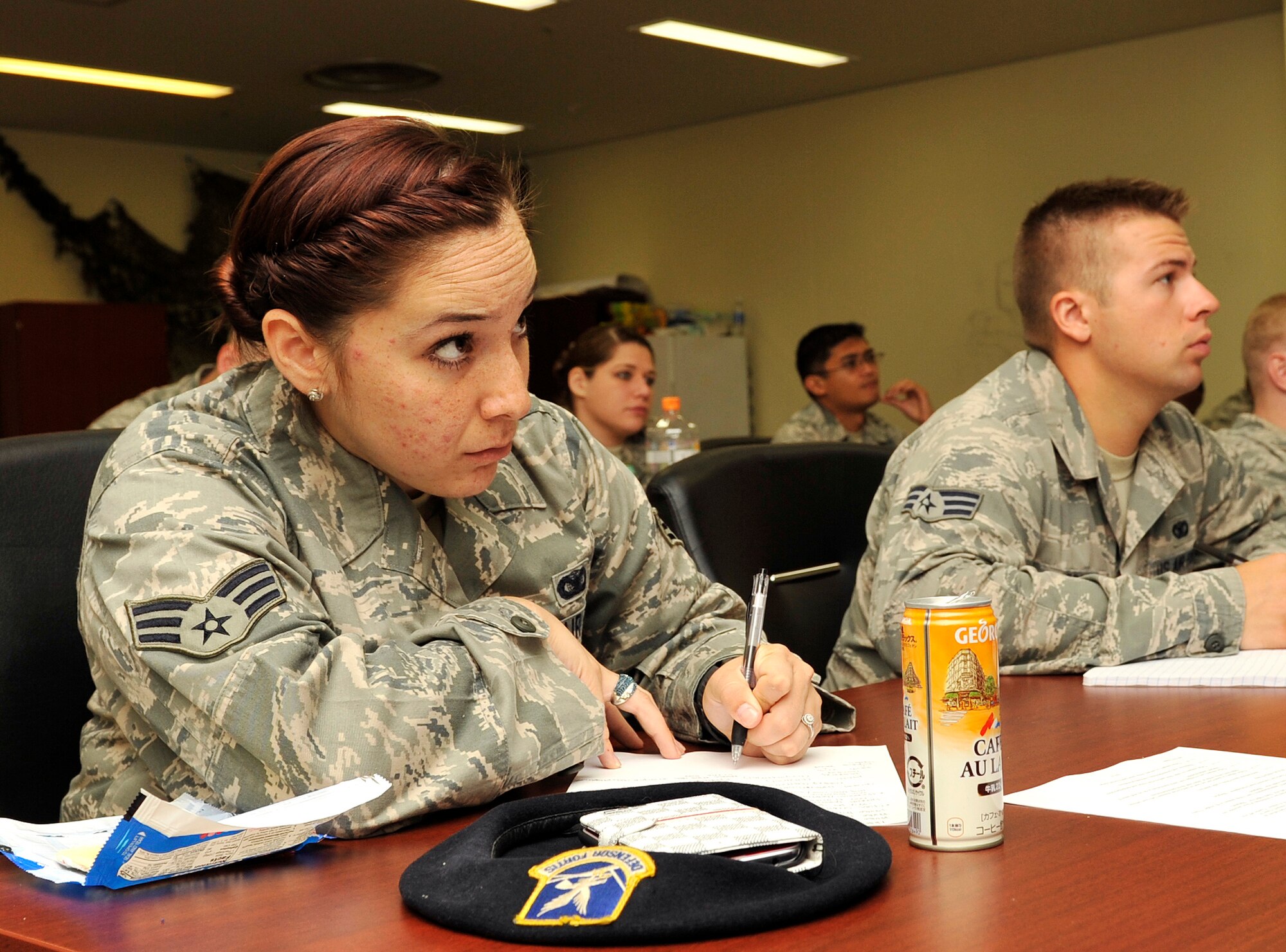 U.S. Air Force Senior Airman Eliza Granados, 18th Security Forces Squadron response force leader, takes notes during the National Highway Traffic Safety Administration Standardized Field Sobriety Test training on Kadena Air Base, Sept. 10, 2014. The training helps individuals gain a better understanding of how to perform several field sobriety tests and recognize indicators that could be present. (U.S. Air Force photo by Naoto Anazawa/Released)