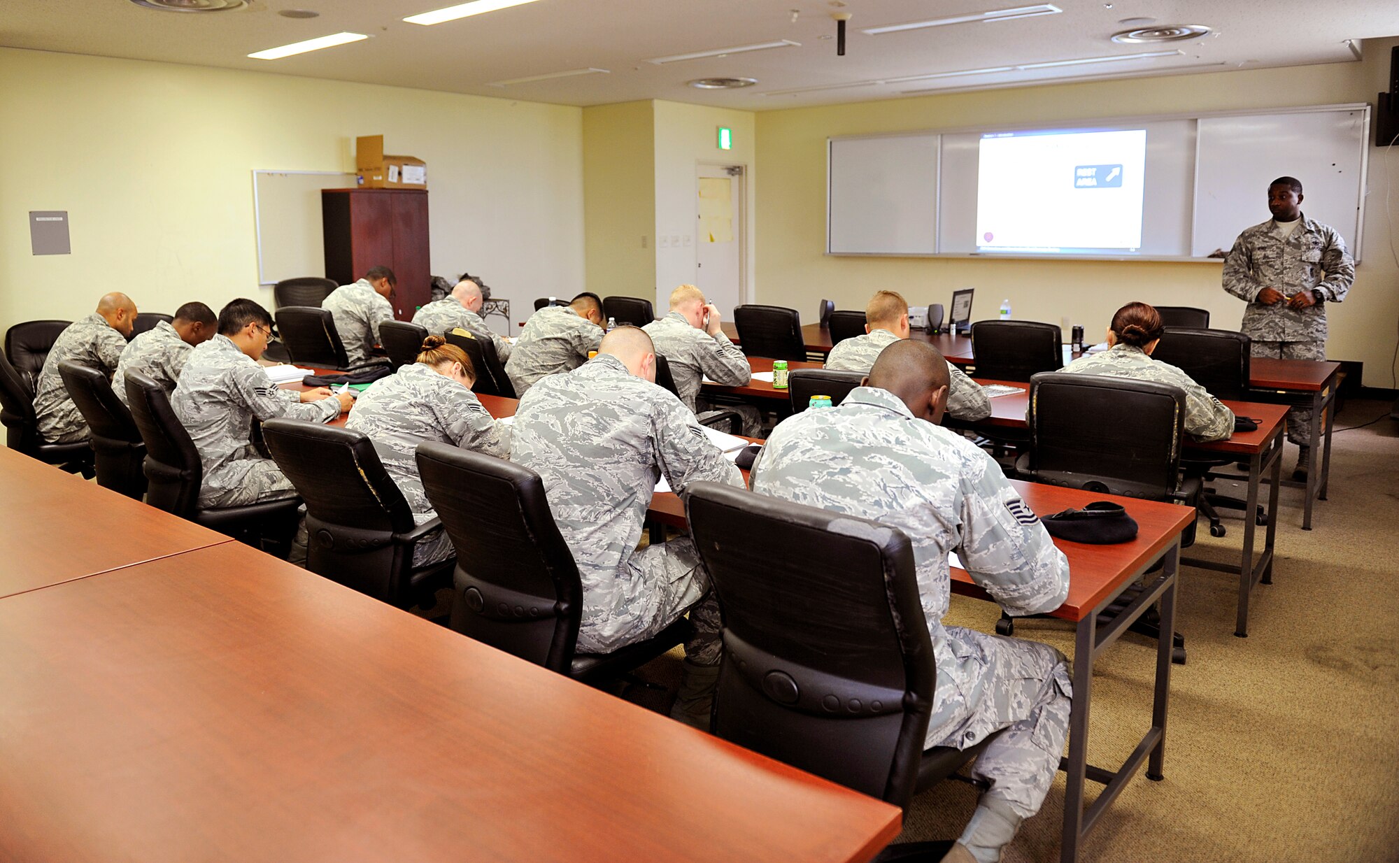 Members of the 18th Forces Squadron take the examination during the National Highway Traffic Safety Administration Standardized Field Sobriety Test training on Kadena Air Base, Sept. 10, 2014. The training is conducted on a monthly basis and is required for more than 400 SFS members. (U.S. Air Force photo by Naoto Anazawa/Released)