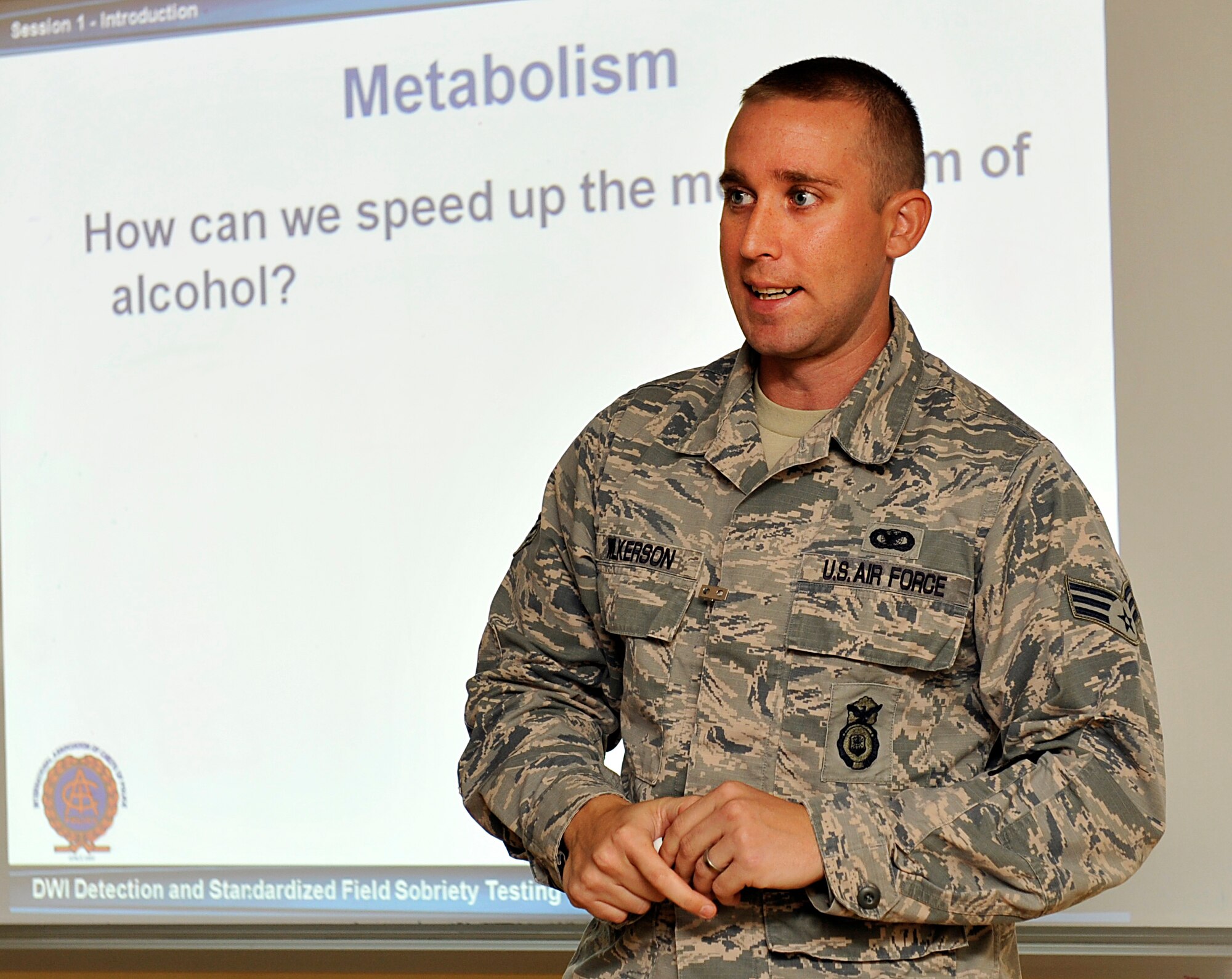 U.S. Air Force Senior Airman Andrew Wilkerson, 18th Security Forces Squadron training instructor, briefs during the National Highway Traffic Safety Administration Standardized Field Sobriety Test training on Kadena Air Base, Sept. 10, 2014. The 18th Security Forces Squadron conducts the training on a monthly basis to help SFS members better understand the effects of alcohol on the body. (U.S. Air Force photo by Naoto Anazawa/Released)
