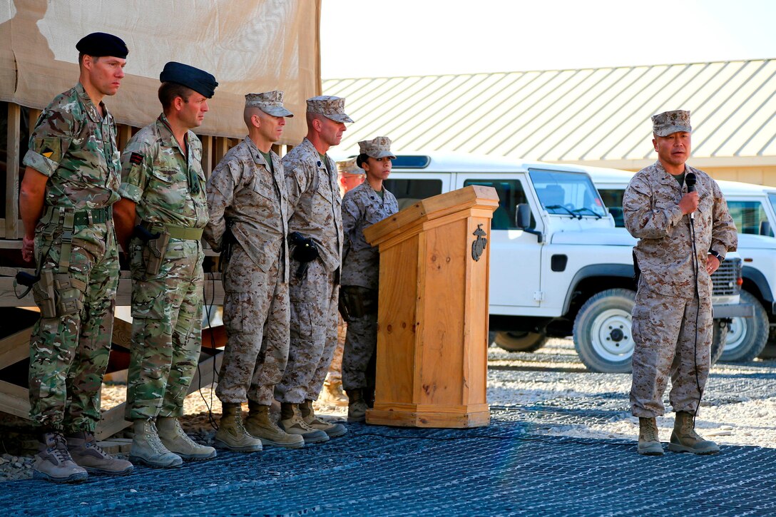 U.S. Marine Corps Brig. Gen. Daniel D. Yoo, right, speaks to Marines, sailors and coalition partners during a 9/11 ceremony on Camp Leatherneck, Helmand province, Afghanistan, Sept. 11, 2014.