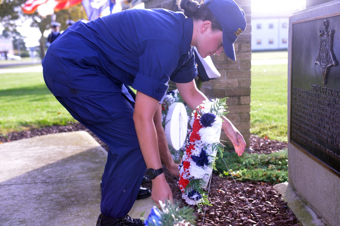 Coast Guard recruit Elizabeth Carson lays a wreath at the foot of the Douglas Munro statue in Cape May, N.J.,Sept. 11, 2014, during a ceremony to remember those who died during the 9/11 terrorist attacks. Carson, who is in her sixth week of training, told other recruits about her uncle who died in the 9/11 attacks at the World Trade Center. 