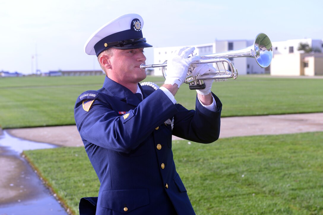 Coast Guard Petty Officer 1st Class Edward Burke plays taps in Cape May, N.J., Sept. 11. 2014. 