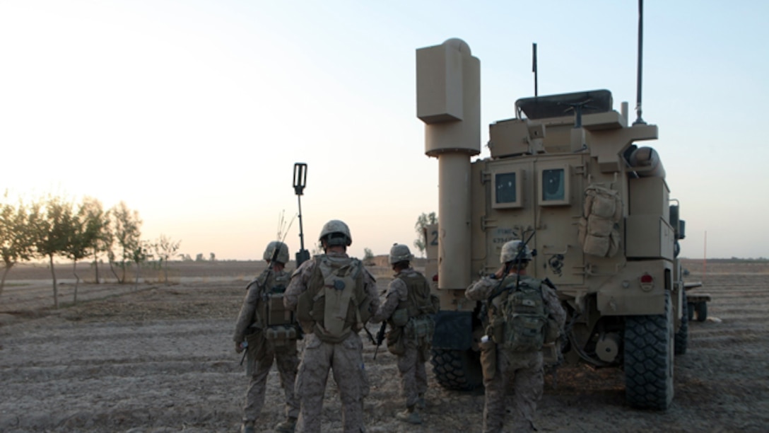 Infantry Marines with Bravo Company, 1st Battalion, 2nd Marine Regiment, look for suspicious activity during a security patrol in Helmand province, Afghanistan, Sept. 3, 2014. The operation was designed to deter enemy insurgents from operating in the southern area of Helmand province. (U.S. Marine Corps photo by Cpl. Cody Haas/ Released)