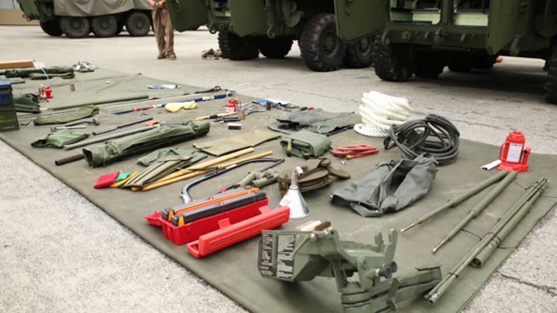 Marines with  Company B, Ground Combat Element Integrated Task Force, conducted a limited technical inspection of five light armored vehicle 25s and one LAV logistics vehicle at the 2nd Light Armored Reconnaissance Battalion ramp, Sept. 9, 2014. Each vehicle came with dozens of tools and upkeep equipment known as stock list level three equipment. From October 2014 to July 2015, the GCEITF will conduct individual and collective level skills training in designated ground combat arms occupational specialties in order to facilitate the standards-based assessment of the physical performance of Marines in a simulated operating environment performing specific ground combat arms tasks. (Official Marine Corps photo by Cpl. Paul S. Martinez/Released)