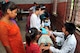 Dr. Seema Jilani, Project Hope pediatrician, and Dr. Richan Jirel, a local general medicine provider, examine a patient at a health services outreach site in Manahari, Nepal, Sept. 9, 2014, as part of Operation Pacific Angel-Nepal. PACANGEL helps cultivate common bonds and foster goodwill between the U.S., Nepal and regional nations by conducting multilateral humanitarian assistance and civil military operations. (U.S. Air Force photo by Staff Sgt. Melissa B. White)