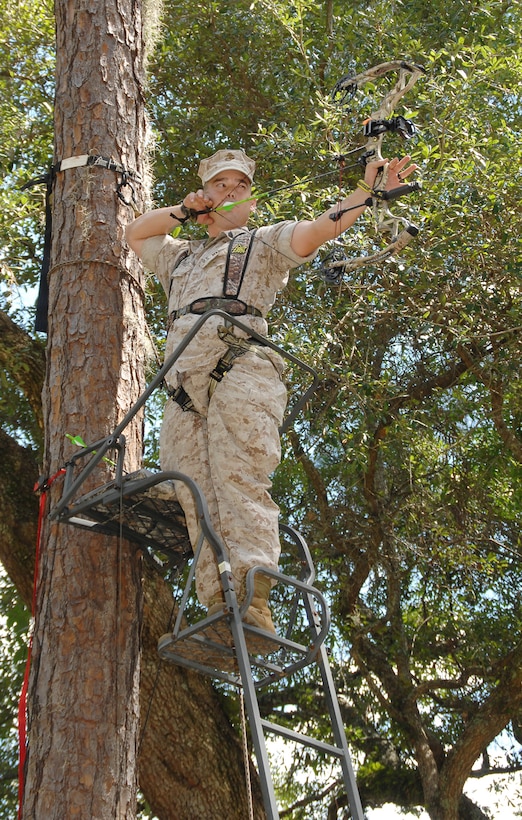 Sgt. Nathan Phelps, telephone technician, Base Telephone Office, Marine Corps Logistics Base Albany, sights in on a 3-D target while practicing with his bow, recently. MCLB Albany deer bow-hunting season begins Saturday.
