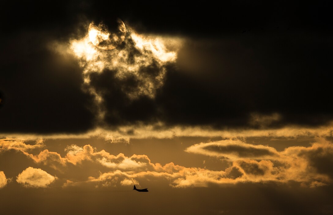 A C-130 Hercules performs aerial spraying of mosquitos Sept. 6, 2014, over Joint Base Charleston, S.C. The insecticide the unit uses is mixed with water to dilute the product. The C-130 and Air Force Reserve aircrew are assigned to the 910th Airlift Wing, Youngstown Air Reserve Station, Ohio. (U.S. Air Force photo/Senior Airman Dennis Sloan)