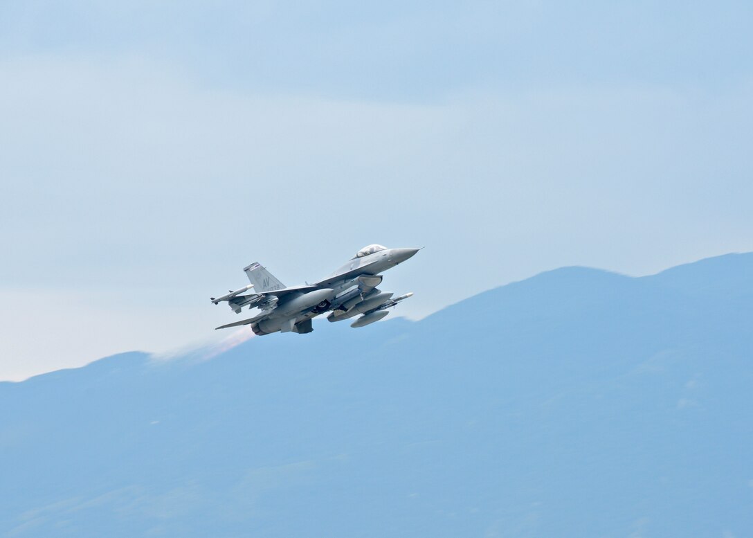 An F-16 Fighting Falcon takes off for Poland, Sept. 5, 2014, from Aviano Air Base, Italy. The 31st Fighter Wing will be participating in a joint training exercise, Ample Strike, to expand upon ongoing efforts to build partnerships and interoperability in Europe. The F-16 is assigned to the 510th Fighter Squadron. (U.S. Air Force Photo/Staff Sgt. Jessica Hines)   