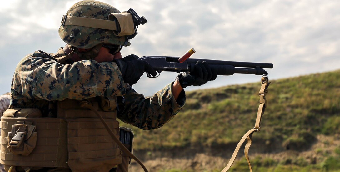 A Marine with Black Sea Rotational Force 14 fires on a target using 12-gauge M-4 shotgun Sept. 8, during a non-lethal weapons range near Mihail Kogalniceanu Air Base, Romania. The Mossberg 590A1 is used in non-lethal weapons training with Eastern European partner nations in the Black Sea, Balkan and Caucasus region. 