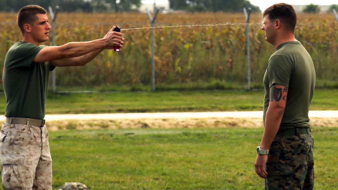 A non-lethal weapons instructor sprays a Marine with Black Sea Rotational Force 14 with Oleoresin Capsicum spray during a non-lethal weapons course on Mihail Kogalniceanu Air Base, Romania, Sept. 3. Marines receive their non-lethal weapons certifications to better share the responsible and effective employment of these tactics during theater security cooperation events with their Eastern European partners. (U.S. Marine Corps photo by Lance Cpl. Ryan Young/released)