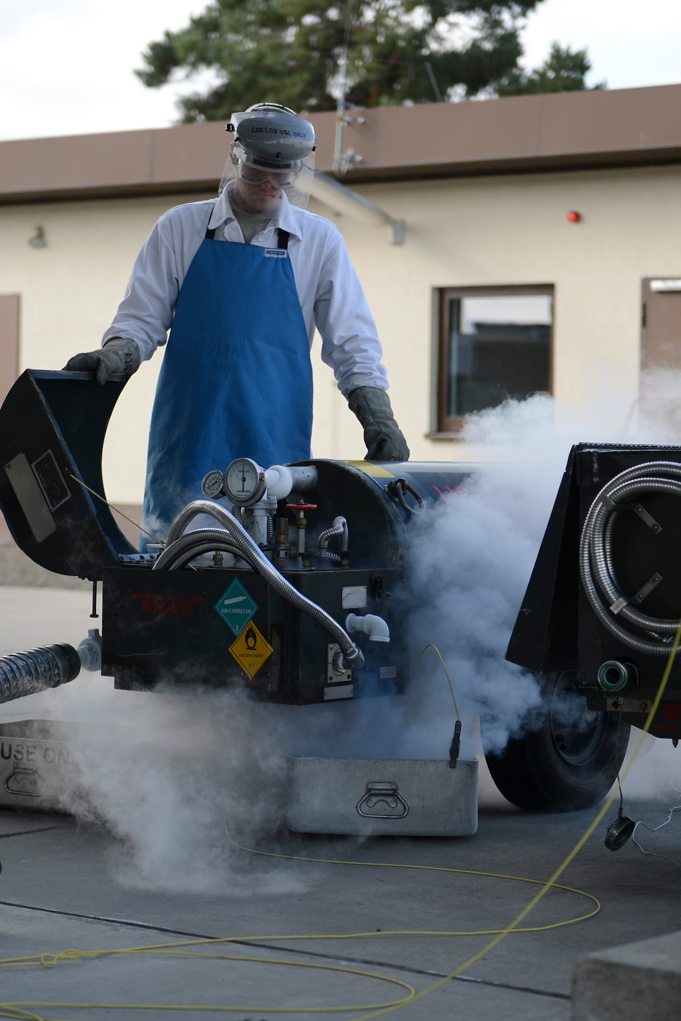Senior Airman Seth Bruning fills a liquid oxygen tank on Ramstein Air Base, Germany, Sept. 3, 2014. Cryogenics receive, store, maintain and issue liquid oxygen and liquid nitrogen to aircrafts so the aircrew can breathe while at higher altitudes. Bruning is a hydrants technician with the 86th Logistics Readiness Squadron. (U.S. Air Force photo/Airman 1st Class Michael Stuart)