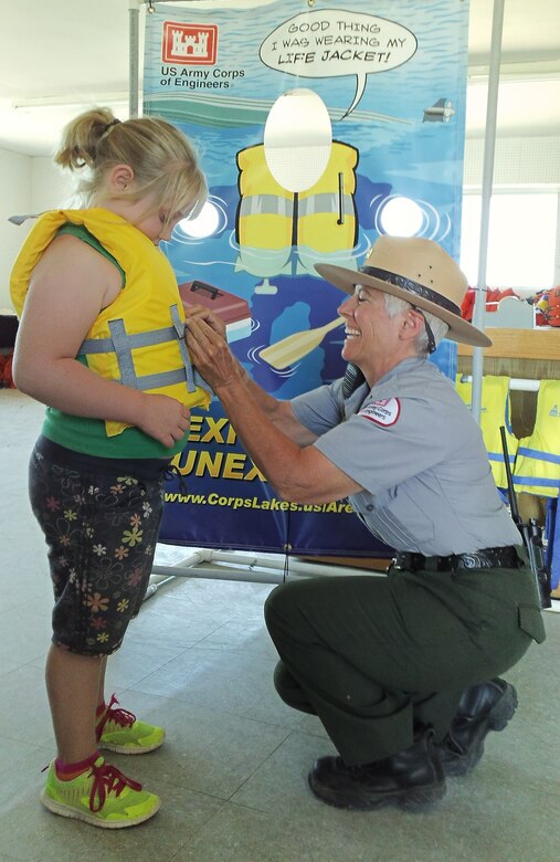 CONCHAS DAM, N.M. -- Park Ranger Valerie Mavis adjusts a girl's life jacket to ensure a proper fit, Aug. 31, 2014.