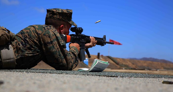 Recruit Daniel T. Bengtson, Platoon 3255, Lima Company, uses rifle combat optics on his M16-A4 service rifle while firing at Edson Range, Weapons and Field Training Battalion, Marine Corps Base Camp Pendleton, Calif., Sept. 4. Traditionally recruits and Marines used iron sights to aim in on their targets, but are taking advantage of new technology using the scope.