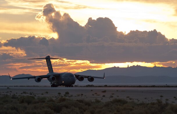 A C-17 Globemaster III performs a wet-runway performance test Aug. 20, 2014, on the flightline at Edwards Air Force Base, Calif. Since Dunlop Tire was selected as the replacement tire for the Globemaster III, the C-17 Global Reach Integrated Test Team at Edwards AFB has been putting the C-17’s new Dunlop tires through wet-and-dry runway takeoff and landing performance tests. (U.S. Air Force photo/ Ethan Wagner)