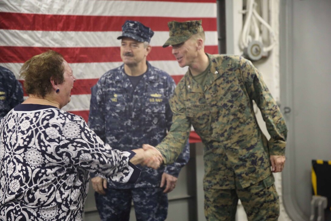 Lieutenant Col.  Terence Connelly, executive officer of Special Purpose Marine Air Ground Task Force South, welcomes U.S. Ambassador to El Salvador Mari Carmen Aponte aboard the future amphibious assault ship USS America (LHA 6), Sept. 8, 2014. Salvadoran officials were hosted aboard America for a key leader engagement (KLE). The KLE consisted of a tour, a formal lunch and a leadership conference discussing the importance of partnership and cooperation between the U.S Naval forces and the Nation of El Salvador. Marines and Sailors with SPMAGTF-South are embarked aboard America in support of her maiden transit, “America Visits the Americas.” The transit demonstrates the unparalleled capabilities that the Navy-Marine Corps team brings to our Nation and partners. (U.S. Marine Corps photo by 1st Lt. Joshua Pena / Released)
