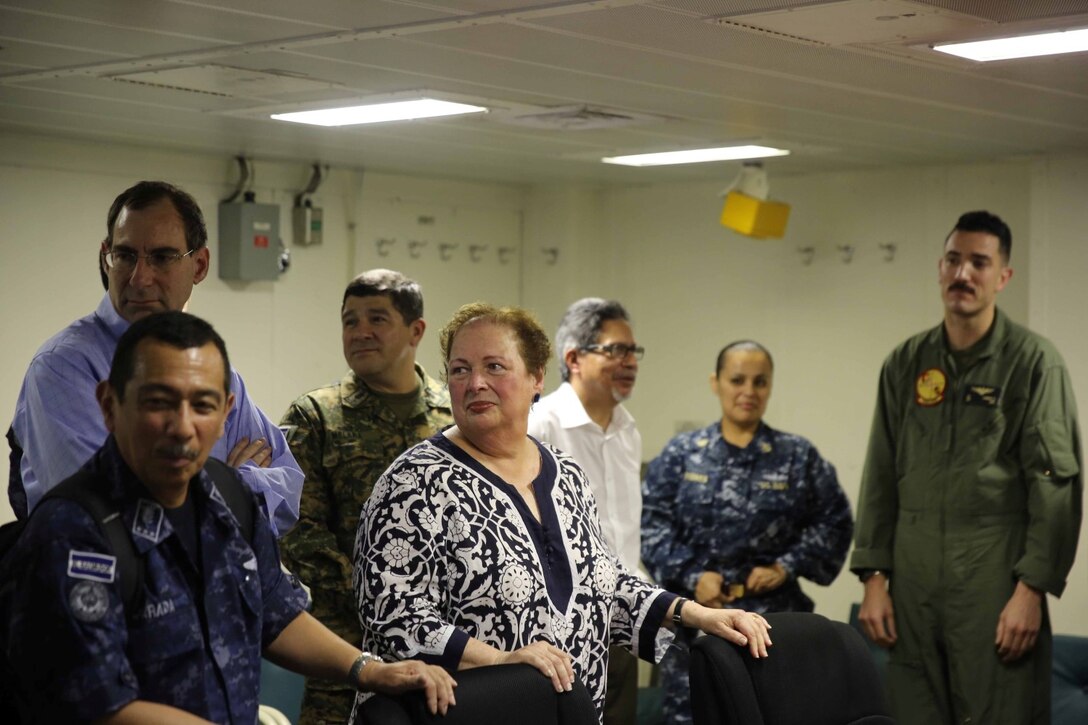 Distinguished visitors from El Salvador are welcomed for a key leader engagement (KLE) aboard the future amphibious assault ship USS America (LHA 6), Sept. 8, 2014. The KLE consisted of a tour, a formal lunch and a leadership conference discussing the importance of partnership and cooperation between the U.S Naval forces and the Nation of El Salvador. Marines and Sailors with Special Purpose Marine Air Ground Task Force South are embarked aboard America in support of her maiden transit, “America Visits the Americas.” The transit demonstrates the unparalleled capabilities that the Navy-Marine Corps team brings to our Nation and partners. (U.S. Marine Corps photo by 1st Lt. Joshua Pena / Released)