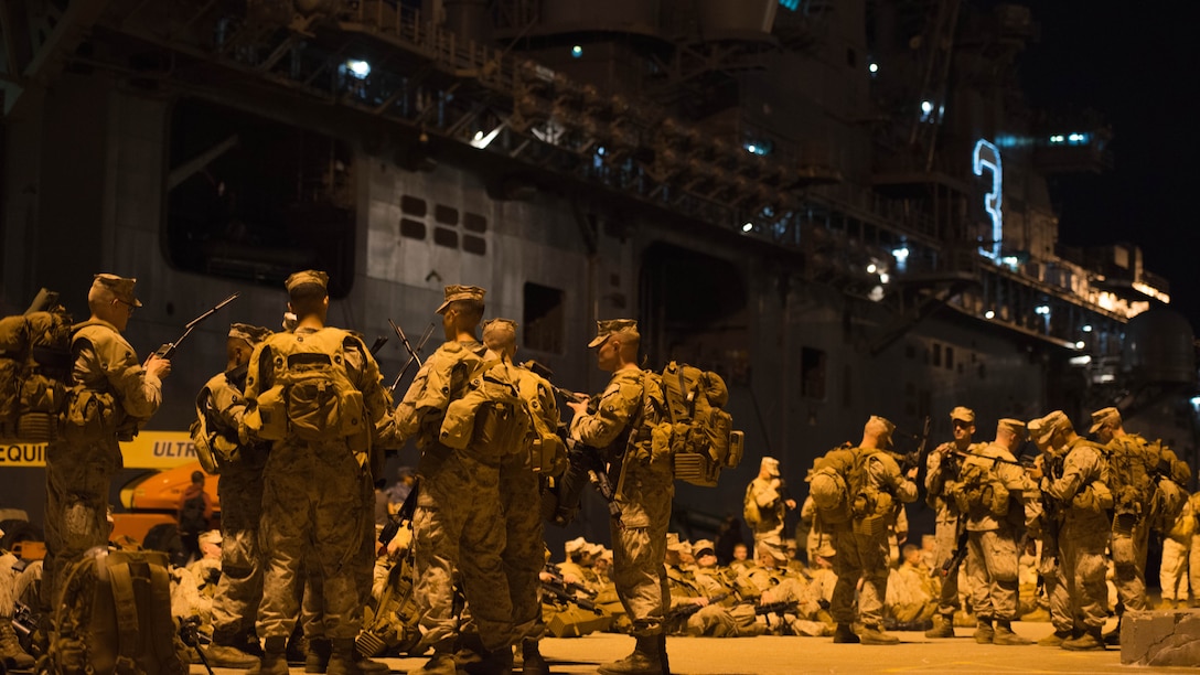 Marine officer students with Charlie Company prepare to begin their movement back to The Basic School, at Marine Corps Base Quantico, Sept. 7 at Naval Station Norfolk, Virginia. as they continue their seven-day War Field Exercise from Sept. 5-12. Marine officers are receiving the foundation to lead Marines upholding the Marine Corps tradition of training to fight in every clime and place.
