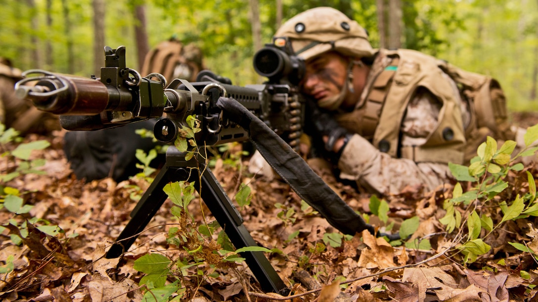 1st Lt. Robert R. Marraffa, a student with Charlie Company at The Basic School at Marine Corps Base Quantico, looks through his optic as he provides security Sept. 8 at the training grounds of Quantico. The Marines are on their seven-day War Field Exercise from Sept. 5-12. Marine officers are receiving the foundation to lead Marines upholding the Marine Corps tradition of training to fight in every clime and place.  
