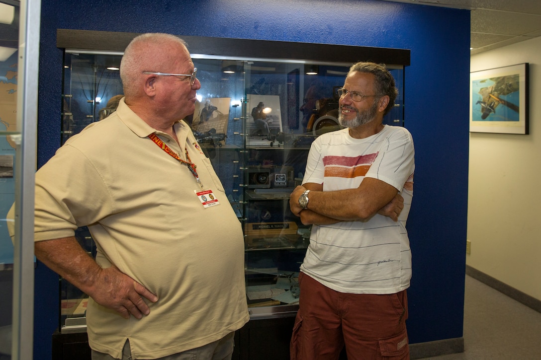 Retired Sgt. Maj. Mike Zacker, secretary of the board of directors and docent at the Flying Leatherneck Aviation Museum and Historical Foundation, reminisces with Dwight Griffin, a former force reconnaissance sniper, at the museum aboard Marine Corps Air Station Miramar, Calif., Sept. 10. The two Marines spoke at length about their tours in Vietnam and compared some of the actions their individual units took.