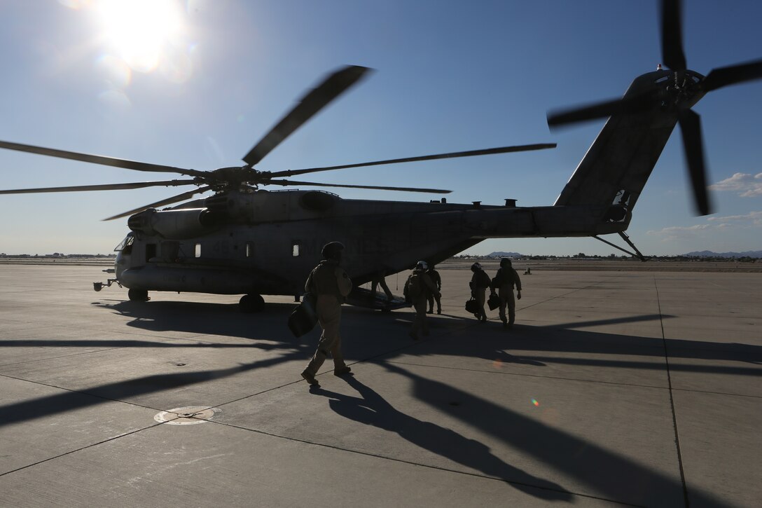 Marines board a CH-53E Super Stallion with Marine Heavy Helicopter Squadron (HMH) 465 as part of a troop transport exercise aboard Marine Corps Air Station Yuma, Ariz., Sept. 11. The Marines were transported from MCAS Yuma to Marine Corps Base Camp Pendleton, Calif.