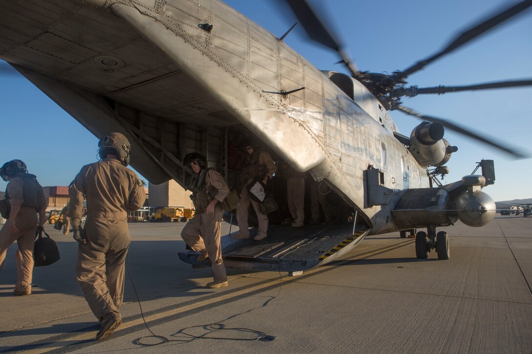 Marines with Marine Aircraft Group 39 exit a CH-53E Super Stallion with Marine Heavy Helicopter Squadron (HMH) 465 aboard Marine Corps Base Camp Pendleton, Calif., Sept. 11. The Marines were transported from Marine Corps Air Station Yuma, Ariz., to MCB Camp Pendleton.