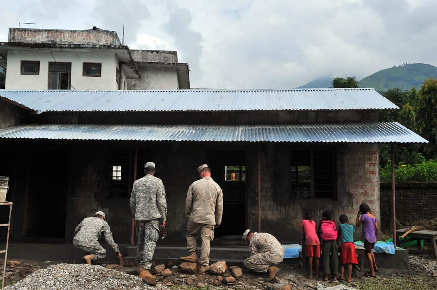 U.S. military members repair stairs for a school as part of an Operation Pacific Angel-Nepal Engineering Civic Action Project in Shaktikhor, Nepal, Sept. 10, 2014. PACANGEL helps cultivate common bonds and foster goodwill between the U.S., Nepal and regional nations by conducting multilateral humanitarian assistance and civil military operations. (U.S. Air Force photo by Staff Sgt. Melissa B. White/Released)