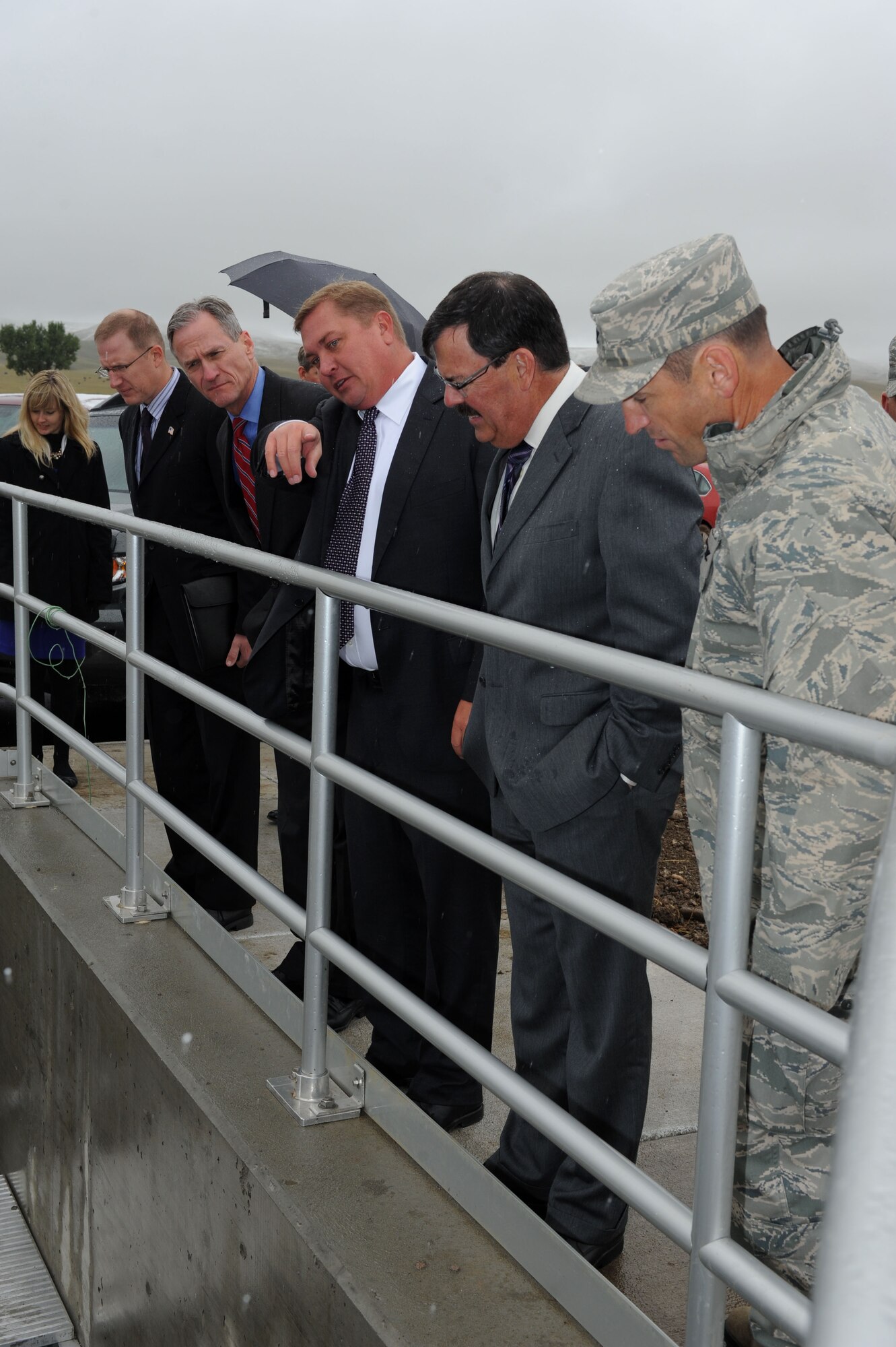 Scott Landguth, Ellsworth Development Authority executive director, explains the water treatment process during a tour of the Box Elder Regional Wastewater Treatment Facility in Box Elder, S.D., Sept. 11, 2014. Guests observed the capabilities of the newly constructed facility serving Box Elder and Ellsworth communities prior to a ceremony marking the completion of the plant. (U.S. Air Force photo by Senior Airman Hailey R. Staker/Released)