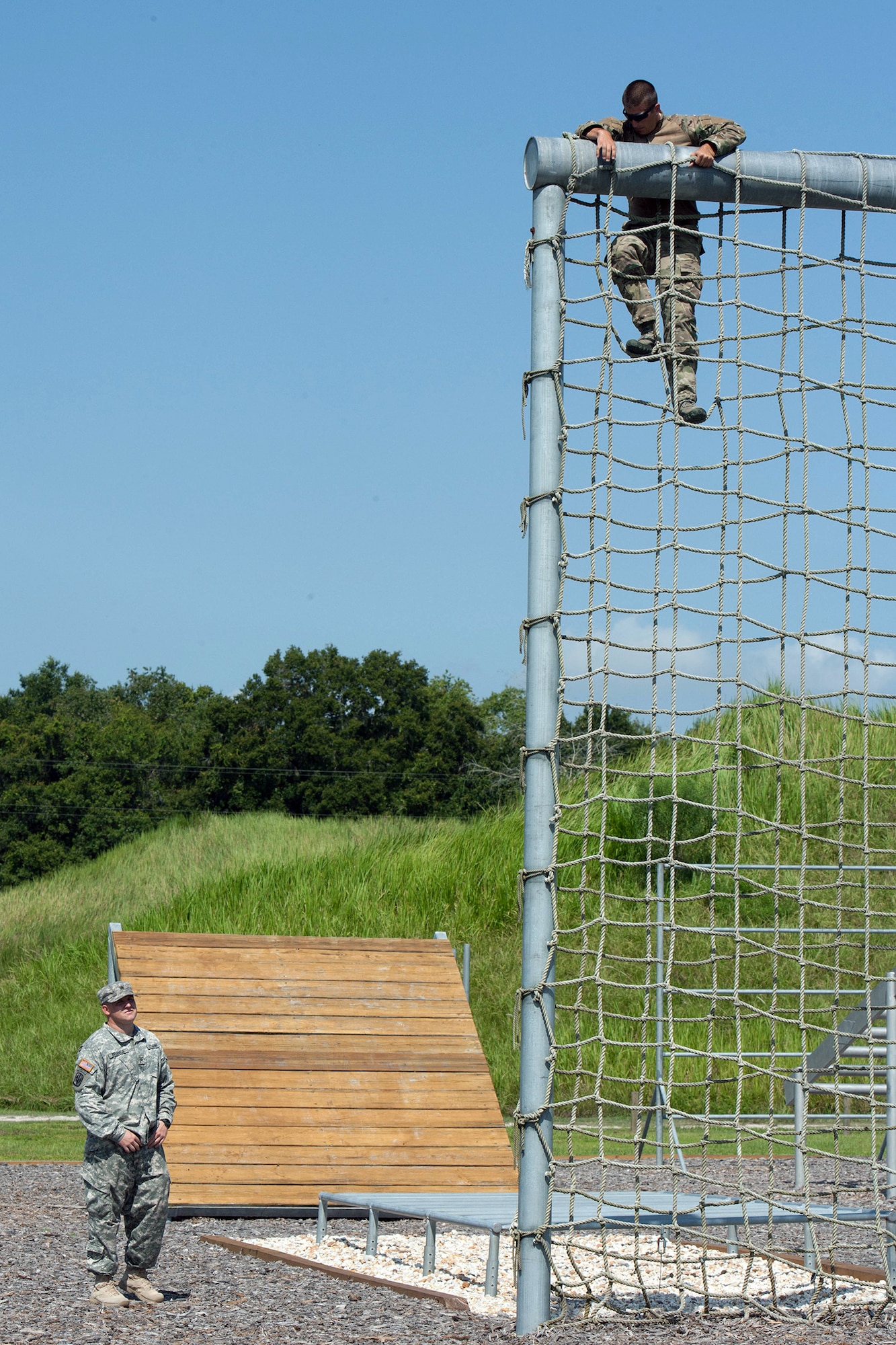 Senior Airman Jeffrey Gebhardt, 446th Force Support Squadron client systems technician, out of Joint Base Lewis-McChord, Washington, climbs over one of the numerous obstacles at Warrior Spirit, Aug. 21, 2014 at MacDill Air Force Base, Florida. Gebhardt has been assigned to the Joint Communications Support Element at MacDill since November 2013, and is on long-term orders to continue his needed support. Warrior Spirit is a weeklong team-based exercise built to validate technical and tactical skills while creating unit cohesion. (Courtesy photo/JCSE)