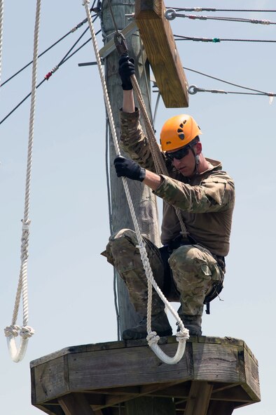 Senior Airman Jeffrey Gebhardt, 446th Force Support Squadron client systems technician, out of Joint Base Lewis-McChord, Washington, hangs around while does working his CST skills at Warrior Spirit, Aug. 20, 2014 at MacDill Air Force Base, Florida. Gebhardt has been assigned to the Joint Communications Support Element at MacDill since November 2013, and is on long-term orders to continue his needed support. Warrior Spirit is a weeklong team-based exercise built to validate technical and tactical skills while creating unit cohesion. (Courtesy photo/JCSE)