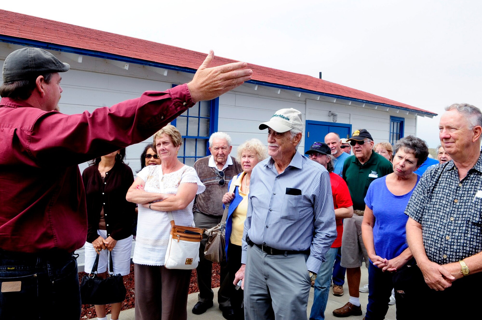 Jay Prichard, 30th Space Wing museum curator, briefs tour participants, Sept. 11, 2014, Vandenberg Air Force Base, Calif. The tour for members of the community began with a lunch catered by the Pacific Coast Club, followed by a walkthrough of the museum and concluded with a trip to Vandenberg’s largest Space Launch Complex, SLC-6. (U.S. Air Force photo by Senior Airman Shane Phipps/Released)

