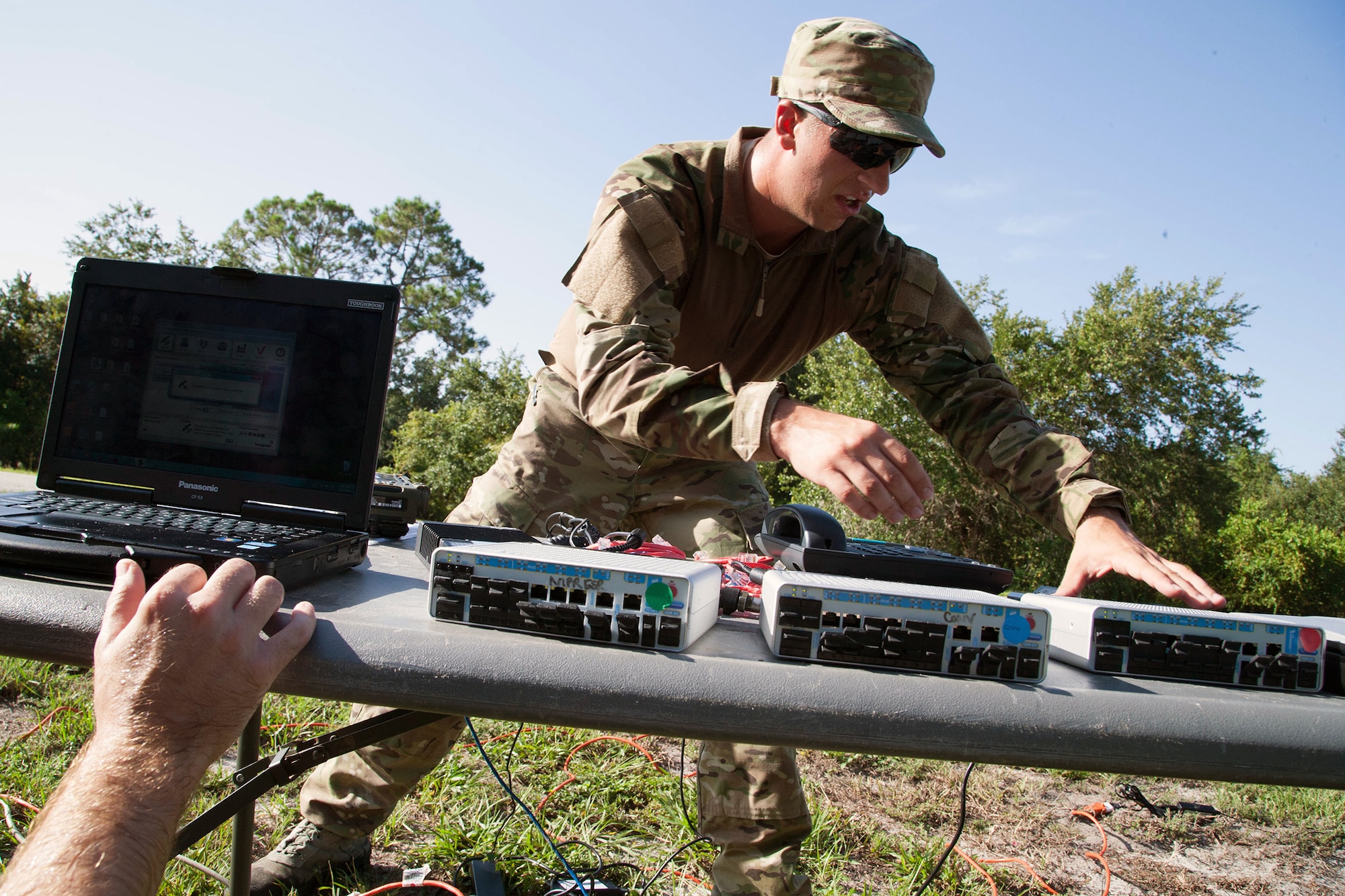 Senior Airman Jeffrey Gebhardt, 446th Force Support Squadron client systems technician, out of Joint Base Lewis-McChord, Washington, does works his CST skills at Warrior Spirit, Aug. 19, 2014 at MacDill Air Force Base, Florida. Gebhardt has been assigned to the Joint Communications Support Element at MacDill since November 2013, and is on long-term orders to continue his needed support. Warrior Spirit is a weeklong team-based exercise built to validate technical and tactical skills while creating unit cohesion. (Courtesy photo/JCSE)