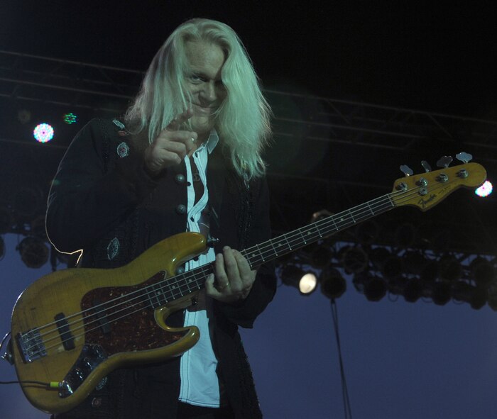 Bruce Hall, REO Speedwagon bass guitarist and harmony vocalist, performs to audience primarily made up of America’s veterans during a Grandstand performance at the Spokane Interstate Fair in Spokane, Washington, Sept. 11, 2014. REO Speedwagon thanked America’s veterans and families, both past and present, for their service and sacrifice in the name of freedom. (U.S. Air Force photo/Staff Sgt. Samantha Krolikowski)