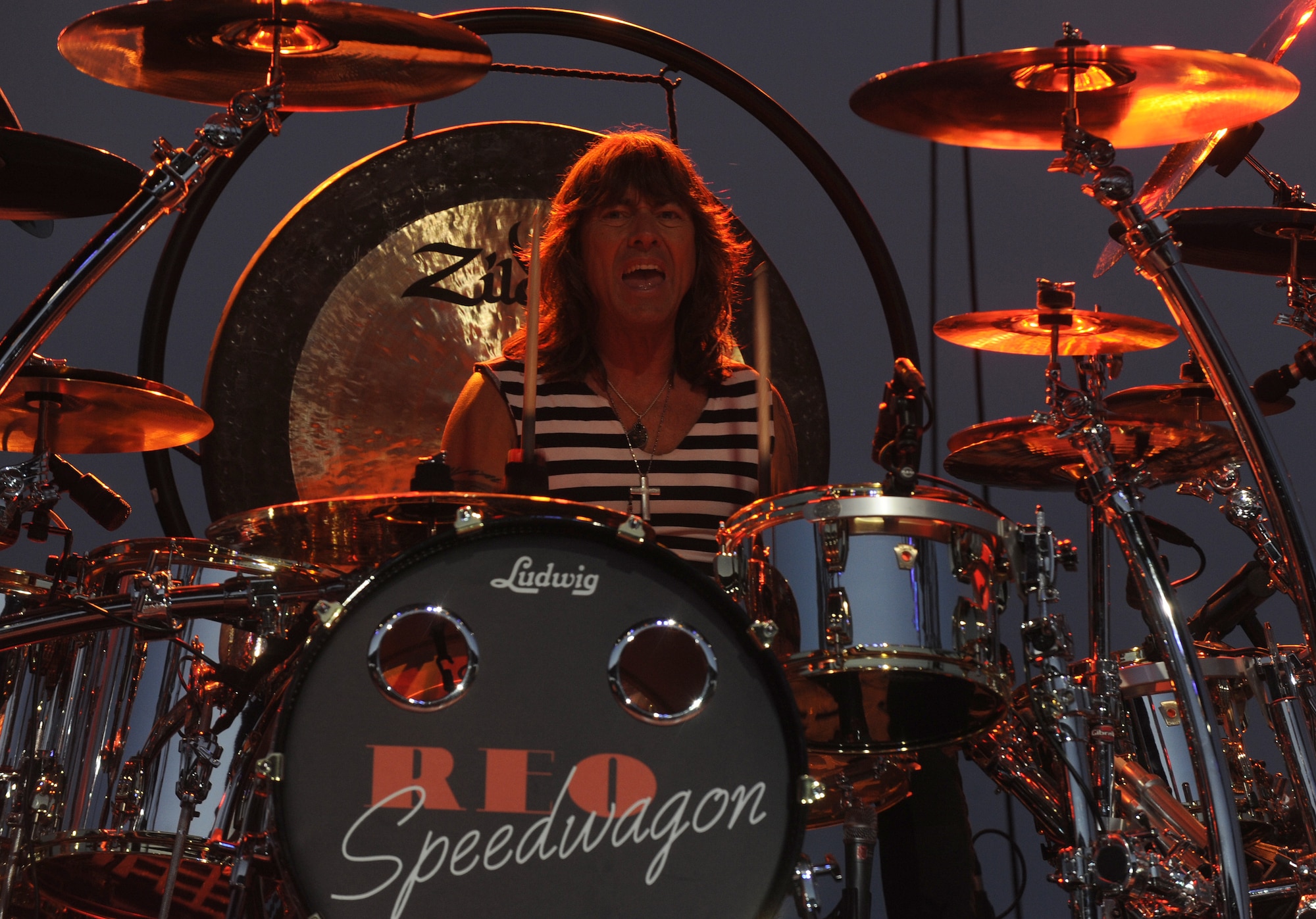 Bryan Hitt, the REO Speedwagon drummer and percussionist, plays the drums during a performance for an audience primarily made up of America’s veterans and the Spokane community at the Spokane Interstate Fair in Spokane, Washington, Sept. 11. 2014. Hitt was chosen by the band after a two-day audition and has been part of the band since 1990. (U.S. Air Force photo by Staff Sgt. Samantha Krolikowski/Released)